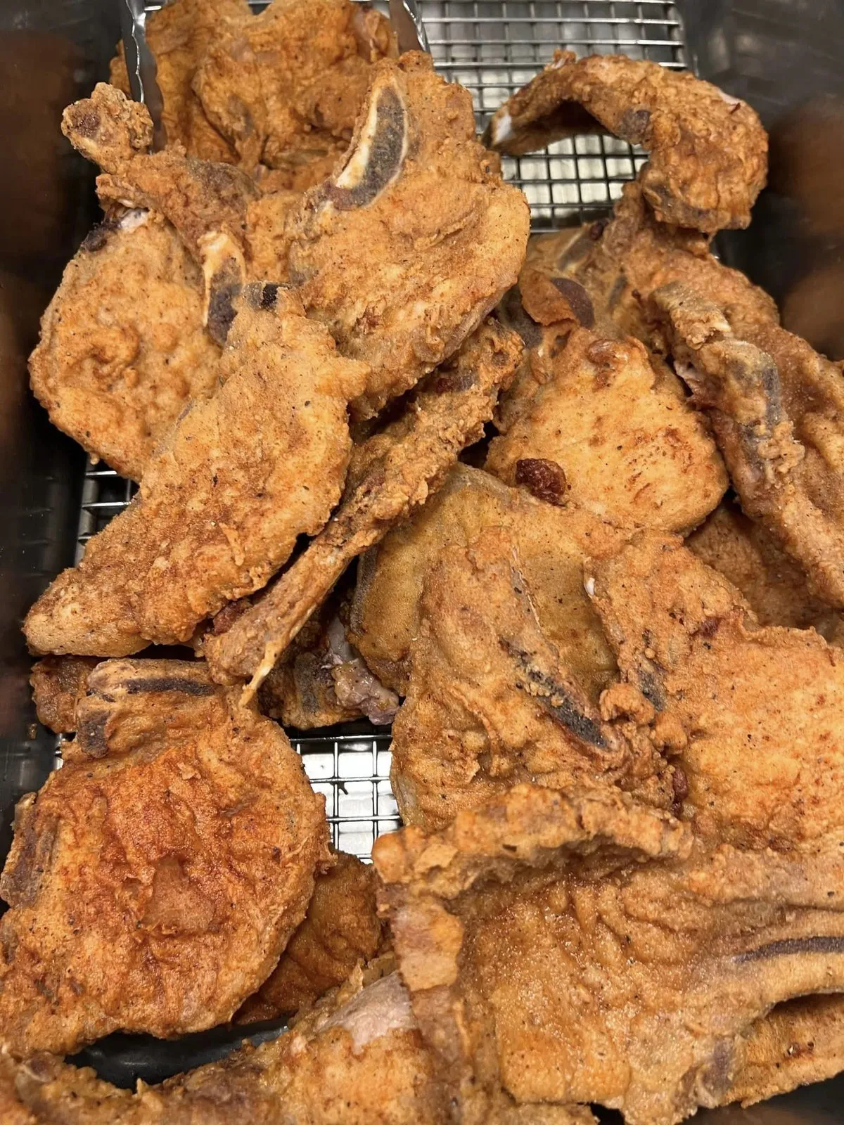 Fried, breaded meat on a wire rack